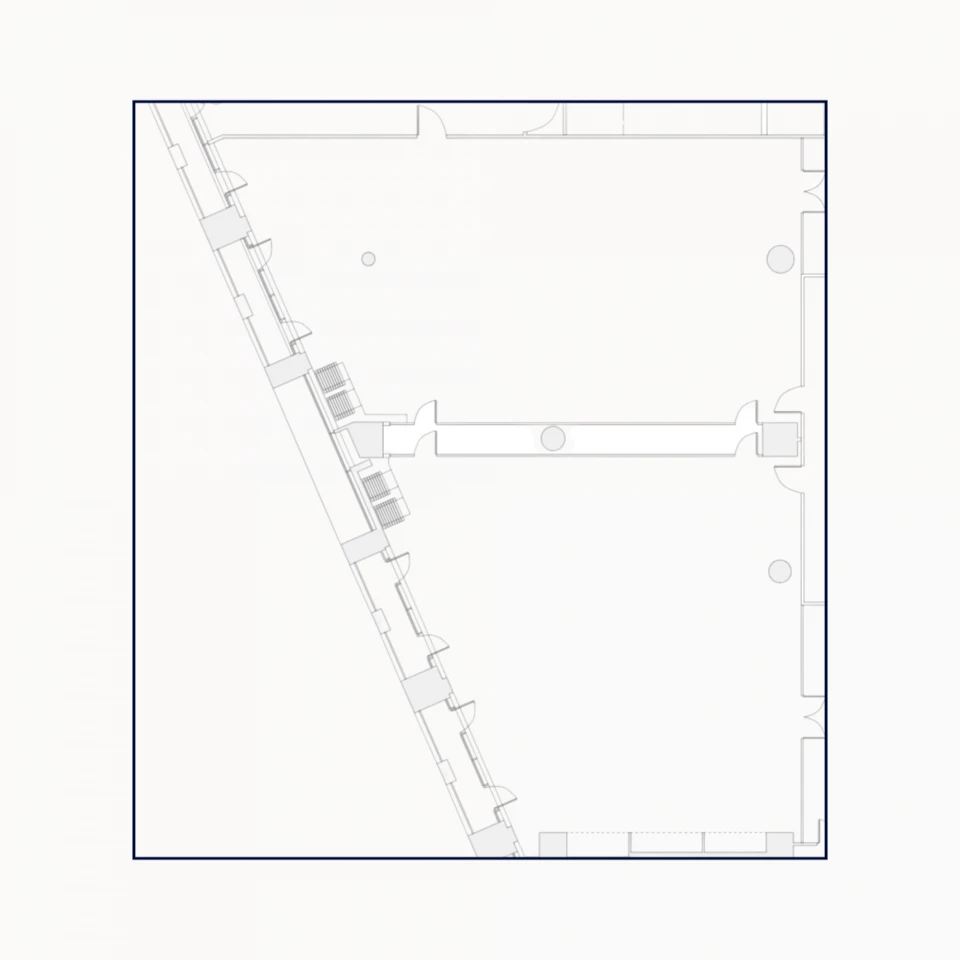 Technical drawing of a building floor plan featuring multiple rooms, stairs, and wall details in a clear linear style.